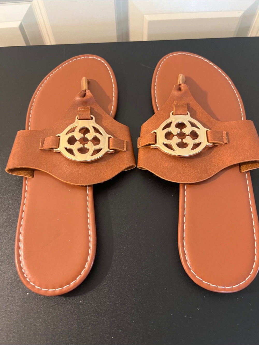 Women’s Tan Leather Slide Sandals with Gold Emblem